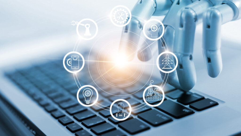 robot che scrive al pc con icone industria